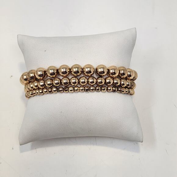 Liz Claiborne Gold Tone Stretch Bracelet Triple Strand Metal Graduated Beads - Picture 1 of 5
